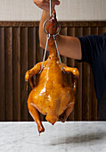 Chinese grilled chicken, hanging