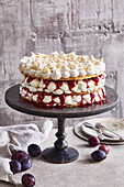 Almond meringue tart with plum compote