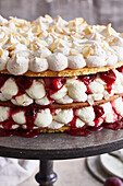 Almond meringue tart with plum compote