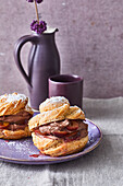 Cream puffs with plums and chocolate cream