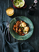 Beef and Guinness stew with pretzel dumplings and steamed white cabbage