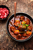 Venison vindaloo with pear and cranberry chutney