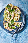 Tarte flambée with smoked trout, potatoes and spinach