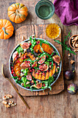 Autumn salad with grilled pumpkin, figs, arugula, and walnuts