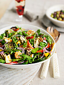 Summer vegetable and rocket salad with halloumi