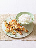 Chilli prawn skewers and rice