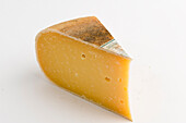 Slice of New Zealand mahoe vintage gouda cow's milk cheese