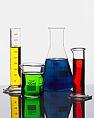 Liquids in laboratory beakers and measuring cylinders