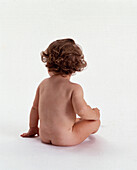 Nude baby with red hair