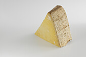 Slice of French cantal AOC cow's milk cheese