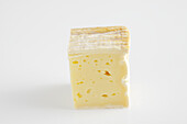 Slice of French pave d'Auge cow's milk cheese