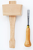 Wooden mallet and ripping chisel upholstery tools