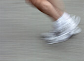 Foot in running shoe in motion