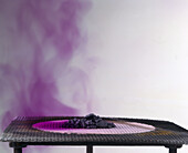 Purple vapours rise from iodine crystals as they are heated