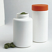 White plastic bottles containing food supplements