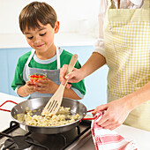 Boy making paella