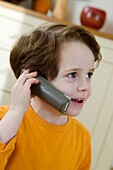 Boy holding mobile phone to ear