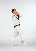 Young cricketer bowling