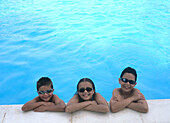 Children at edge of swimming pool