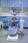 Girl sitting in dentist's chair