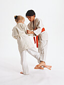 Boy and girl practising judo