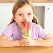 Girl licking an ice lolly