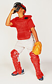 Boy wearing catcher equipment