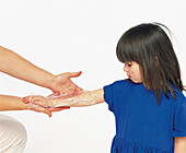 Cling film as dressing for burn on child's forearm