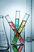 Test tubes with coloured liquids in a beaker