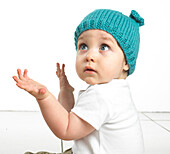 Toddler wearing knitted hat with ears
