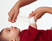 Bandaging a baby's arm