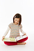 Girl sitting reading a book