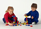 Boy and girl building with blocks