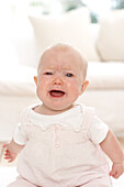 Crying baby girl with mouth open