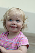 Baby girl in striped pink T-shirt