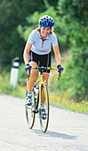 Cyclist on country path