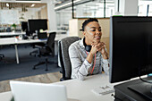 Businesswoman working at computer in office