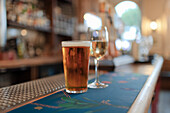 Beer and white wine on bar counter