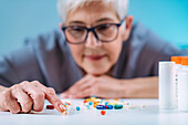 Senior patient counting pills
