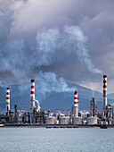 Heavy smoke over an oil refinery