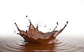 Liquid chocolate crown splash with ripples, illustration