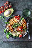 Quinoa salad with roasted sweet potato, chicken breast, avocado and cherry tomatoes
