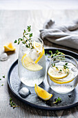 Sparkling water with lemon and thyme