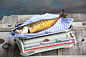 Smoked fish on kitchen scales (rich in vitamin D)