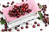 Fresh cherries with kitchen scales