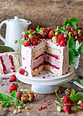 Strawberry buttercream tart with a baked strawberry cheesecake layer