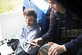 Teenage boys using smartphone