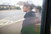 Teenage boys waiting at bus stop