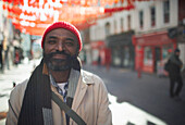 Happy man on sunny city street