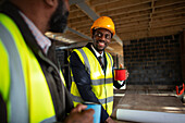 Architects drinking coffee at construction site